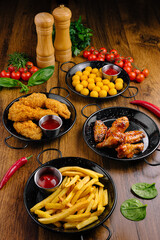 Delicious variety of appetizers served on a wooden table