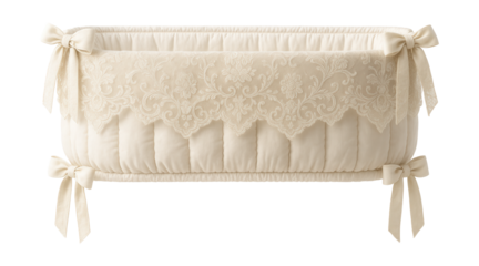 Crib bumper with an intricate lace overlay for a vintage-inspired nursery decor.