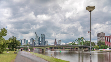 Hyperlapse of Frankfurt's Main Iron Footbridge against the financial district skyscrapers skyline...