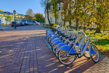 Row of Public Rental Bicycles in an Autumn City Park