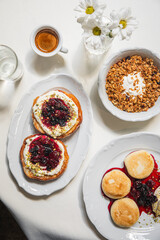 Sweet breakfast with syrniki granola and espresso on sunny table