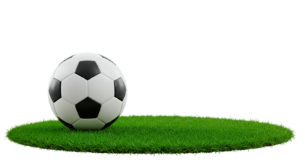 A soccer ball resting on a patch of green grass against a dark background in a studio setting