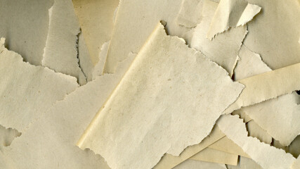 Pieces of torn paper. Old paper texture. Vintage antique sheet paper texture. Aged and yellowed paper background.