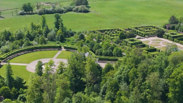 green areas surrounding ch&acirc;teau seneffe including dry ponds well maintained parks fields create picturesque setting for left to right pans aerial of de 