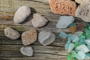 Baltic Sea Stones Glass and Fossils Collection on Wooden Background