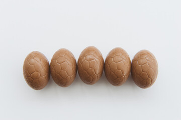 Five easter eggs on white background
