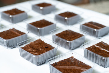 Neatly Arranged Rows of Packaged Fuggy Brownies