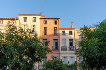 Colorful residential buildings in Perpignan, France during golden hour