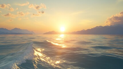 Golden sunset over calm ocean, mountains in the distance