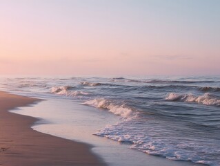 Waves wash onto beach at sunset.