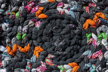 Macro texture of braided recycled fabric rug