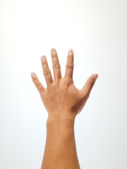 Fototapeta premium Close-Up of Raised Hand Against a Plain White Background