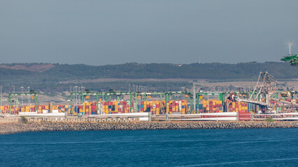 Aerial view of container cargo terminal of commercial port timelapse, business logistics and...
