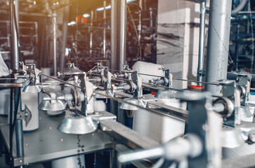 Industrial type of socks production. Sock factory, automated process of automatic socks production.