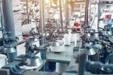 Industrial type of socks production. Sock factory, automated process of automatic socks production.