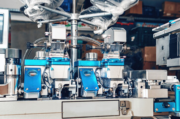 Machine for sewing the toe area of socks. Front view. Textile industry, automatic knitting of socks.