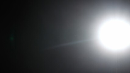 Real optical lens flare on black background