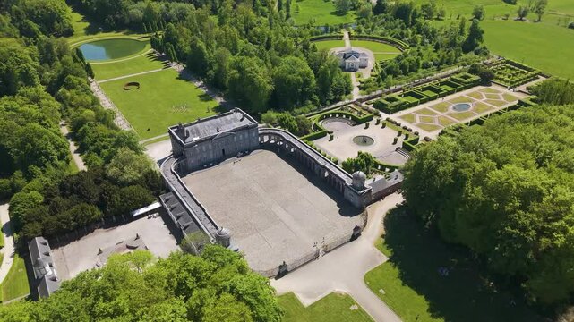 ch&acirc;teau seneffe full area numerous buildings grounds green cover trees surrounding estate create picturesque landscape circles aerial of de belgium 