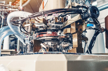 Socks production on knitting machine. Threads, parts, socks production. Dust from threads.
