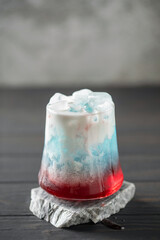 Cherry blue dirty soda in glass. Trending summer drink