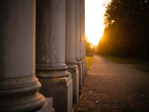 Architecture columns background with sunset light and path way leading to horizon view
