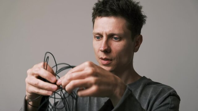 Tangled microphone cables hint its time to switch to a wireless or Bluetooth mic. Home vlog setup frustration.