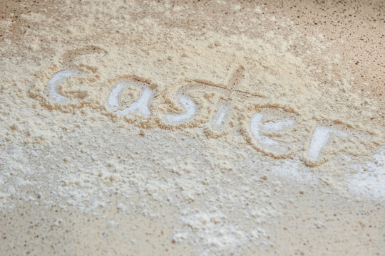 Easter written in flour on the kitchen bench