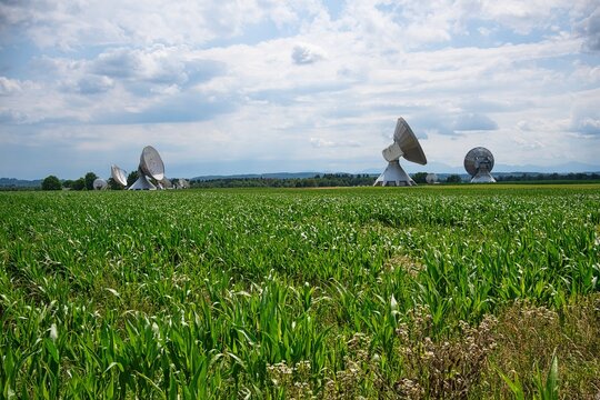 Satellite dish, Raisting Satellite Earth Station, satellite communications, big size satellite dish antennas under sky, Germany.