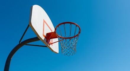 Naklejka premium Basketball hoop and backboard against clear blue sky outdoor. Sport equipment for playing on playground. Concept for active game.