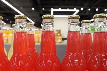 A Collection of Vibrantly Colored Bottles Filled with Refreshing Soft Drinks on Display