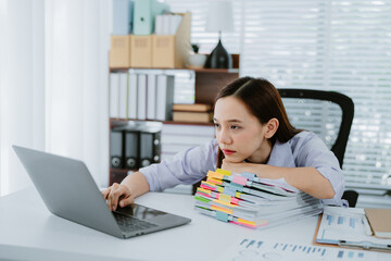 Asian businesswomen, tired, stressed office workers, headaches over delayed work hours. Body aches,...