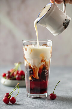 Cherry cola dirty soda in glass. Trending summer drink