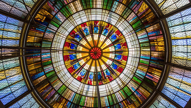 Ornate Stained Glass Dome A Kaleidoscope of Colors and Geometric Patterns Illuminating Architectural Grandeur with a Circular Symphony of Light