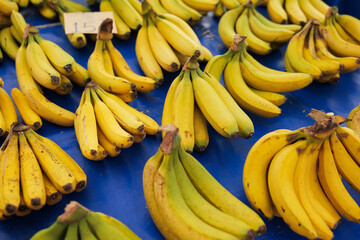 Fresh bananas for sale at local market with vibrant colors and appealing arrangement