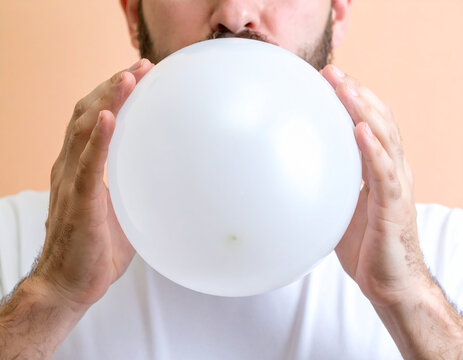 Person Blowing Up Balloon: Festive Celebration Preparation, Joyful Party Moment, Happy Birthday & Playful Fun


