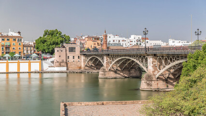 Puente de Isabel II bridge timelapse hyperlapse over the Guadalquivir River, Seville, Spain