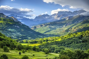 Naklejka premium Breathtaking mountain view from a high summit with lush green valleys and dramatic clouds in the sky