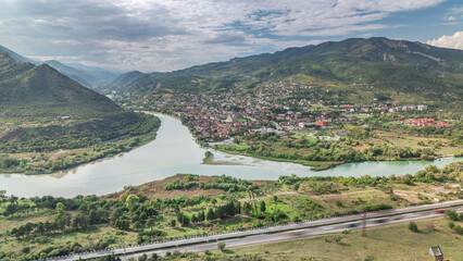 Aerial view of the merger of two rivers Kura or Mtkvari and Aragvi into one timelapse. Georgia