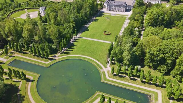 ch&acirc;teau seneffe large water filled pond complete buildings compound sun reflecting revealing backside circles aerial view of de belgium 