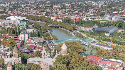 Aerial timelapse of the Bridge of Peace, a bow-shaped pedestrian bridge in Tbilisi, Georgia © HyperlapsePro