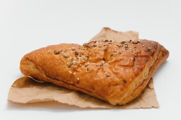 Puff pastry triangle filled with with jam on white background