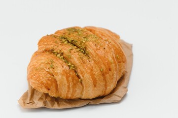 fresh baked croissant isolated on white background
