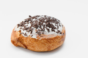 freshly baked sweet cinnamon roll isolated on white background, top view