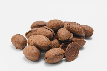 Delicious nut shaped cookies with boiled condensed milk on white background