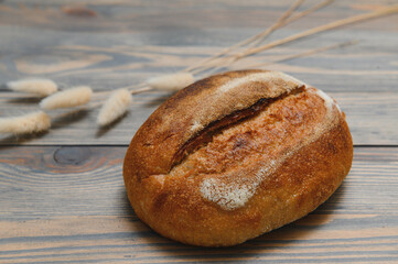 Fresh bread isolated on a wooden background