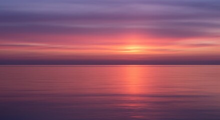 Naklejka premium A peaceful sunset over the ocean with soft pink and purple color gradient sky