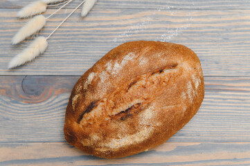 Fresh bread isolated on a wooden background