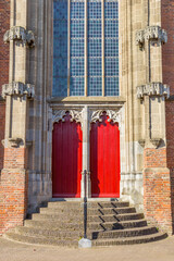 Red doors of the historic Cunera church in Rhenen, Netherlands