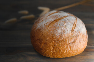 Fresh bread isolated on a wooden background