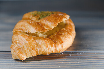 fresh croissant on a wooden background